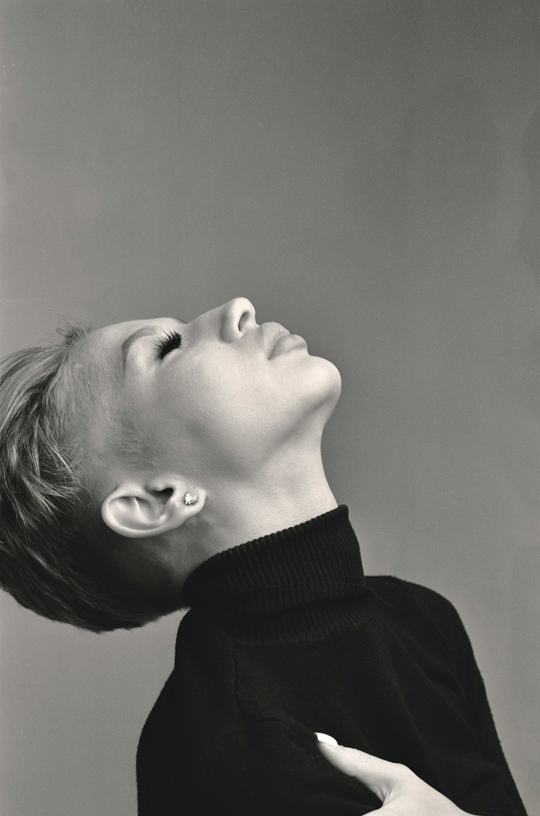 Studio portrait of an older woman with short hair